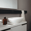 Agape Spoon XL Aufsatzwaschbecken, zeitlose Eleganz, auf einem modernen Unterschrank.